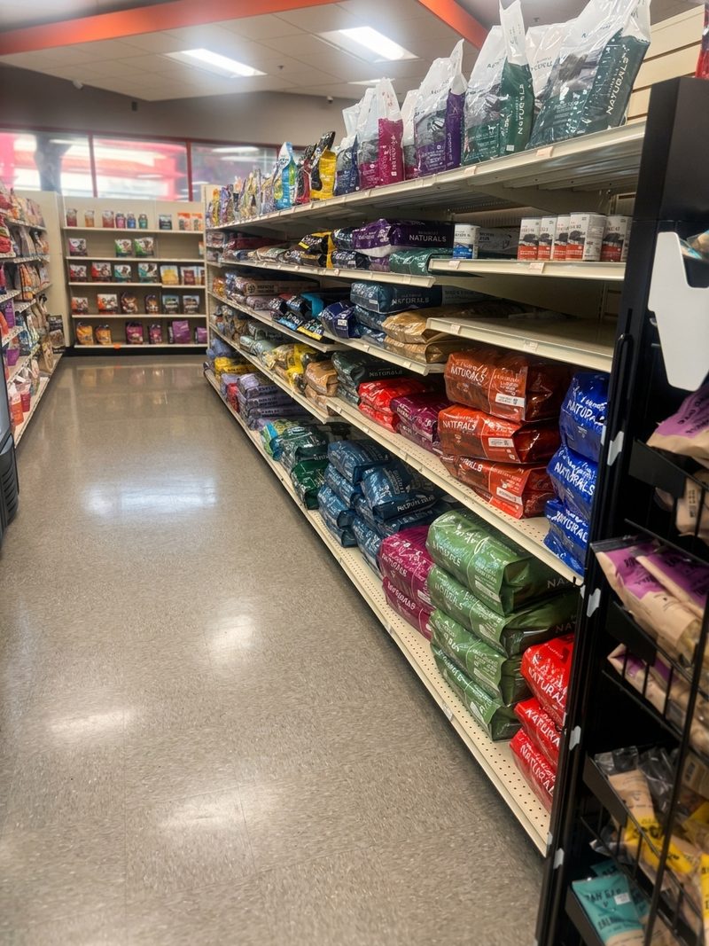 An aisle of dog and cat food bags